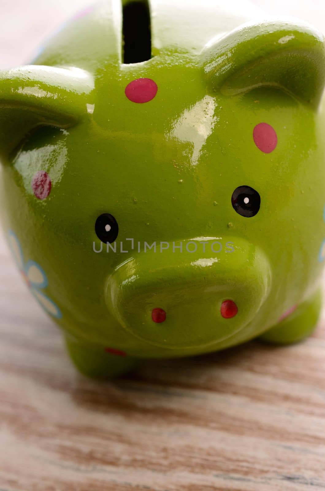 Closeup of a green piggy bank