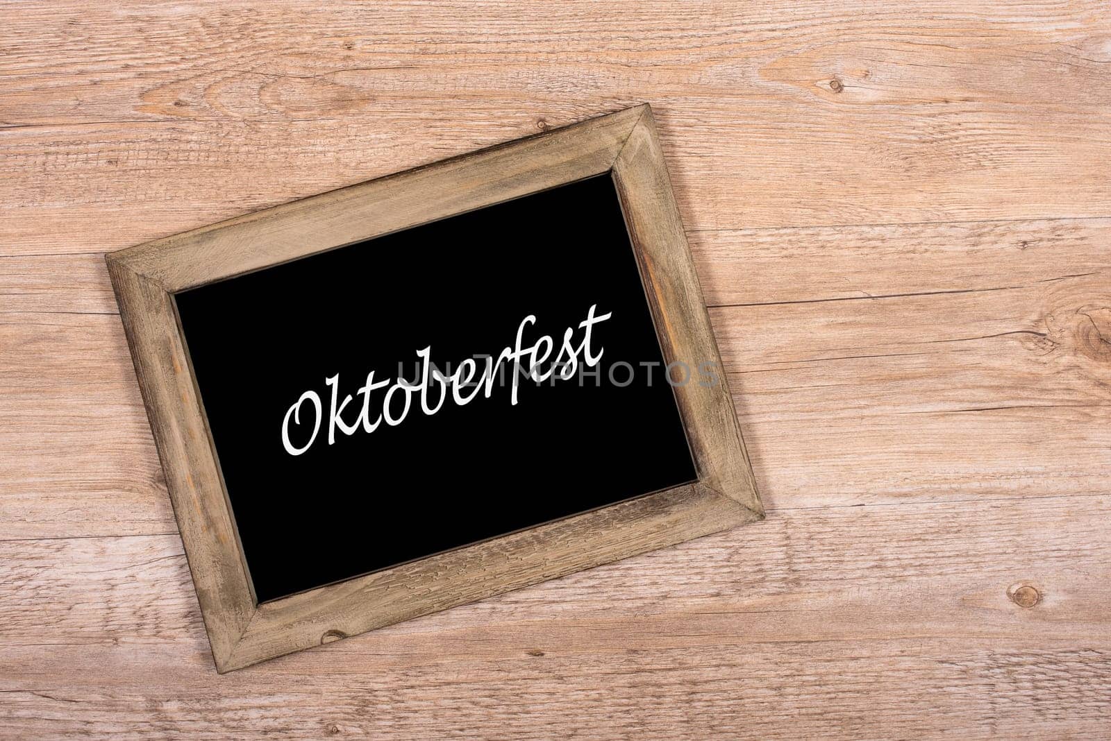 Black black board with wooden with text Oktoberfest