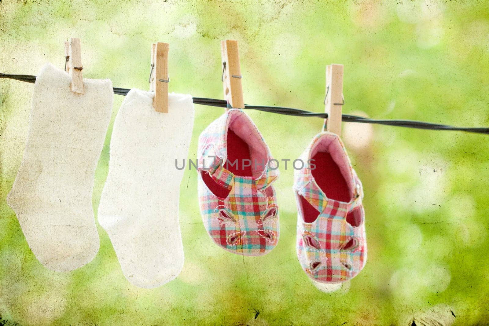 Old photo of baby clothes hanging on the clothesline