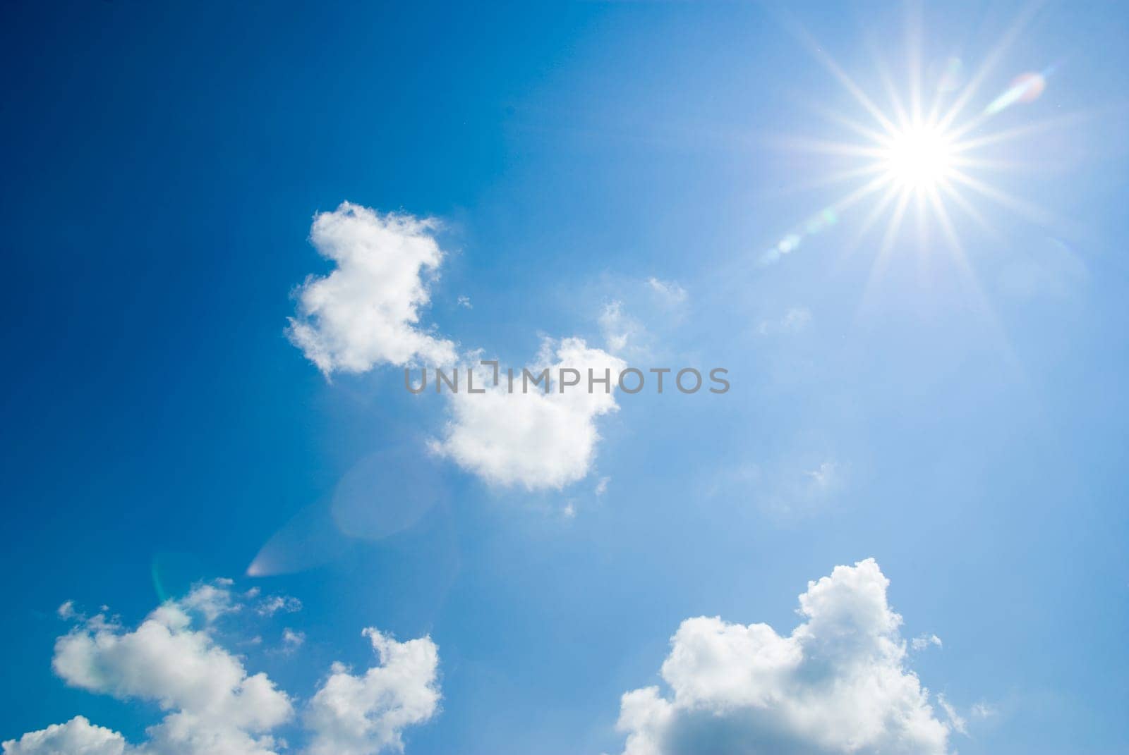 blue sky background with tiny clouds
