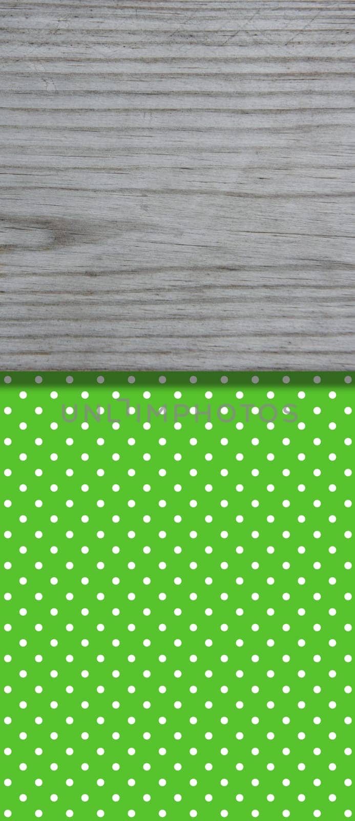 Green dotted background with grey wooden board