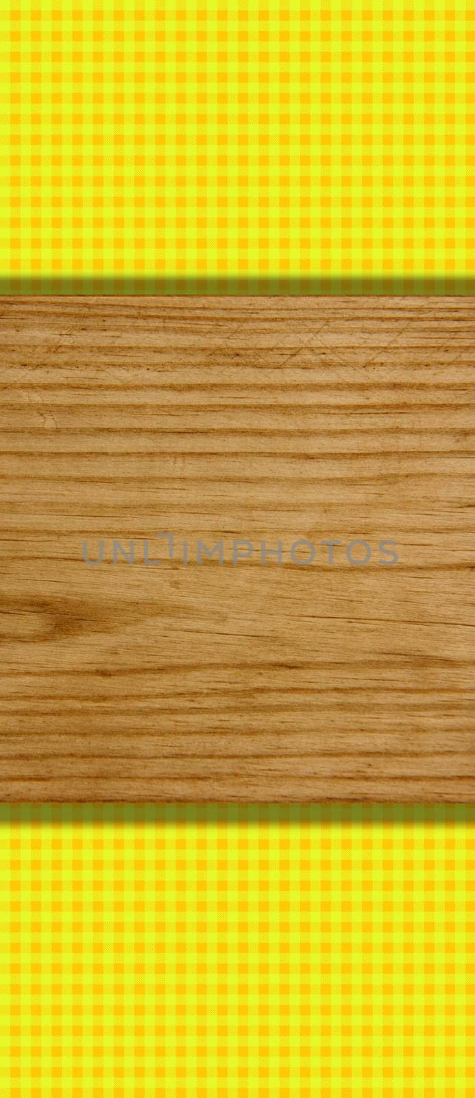 Yellow-orange checkered tablecloth with wooden board