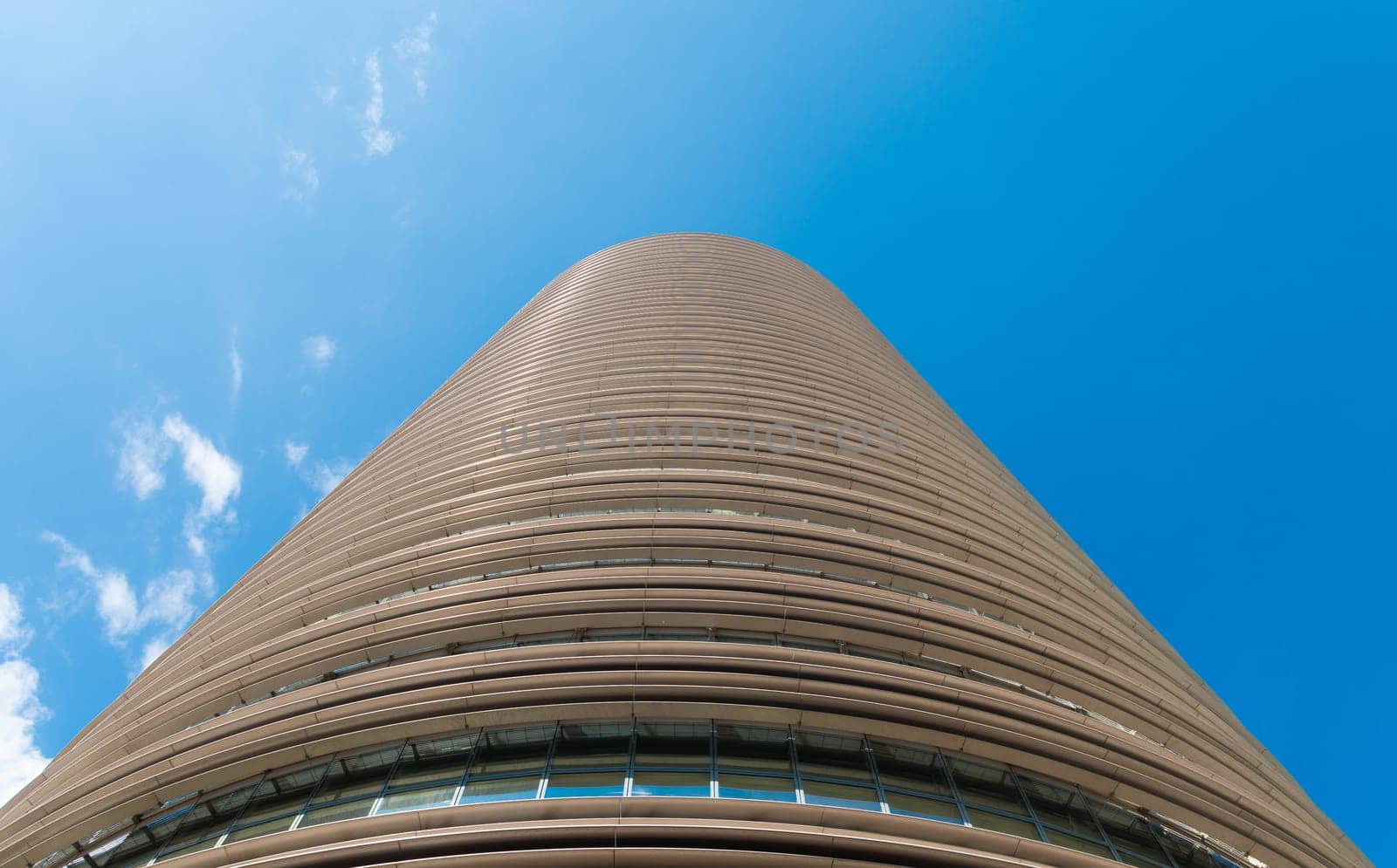 high-rise office building against a blue sky