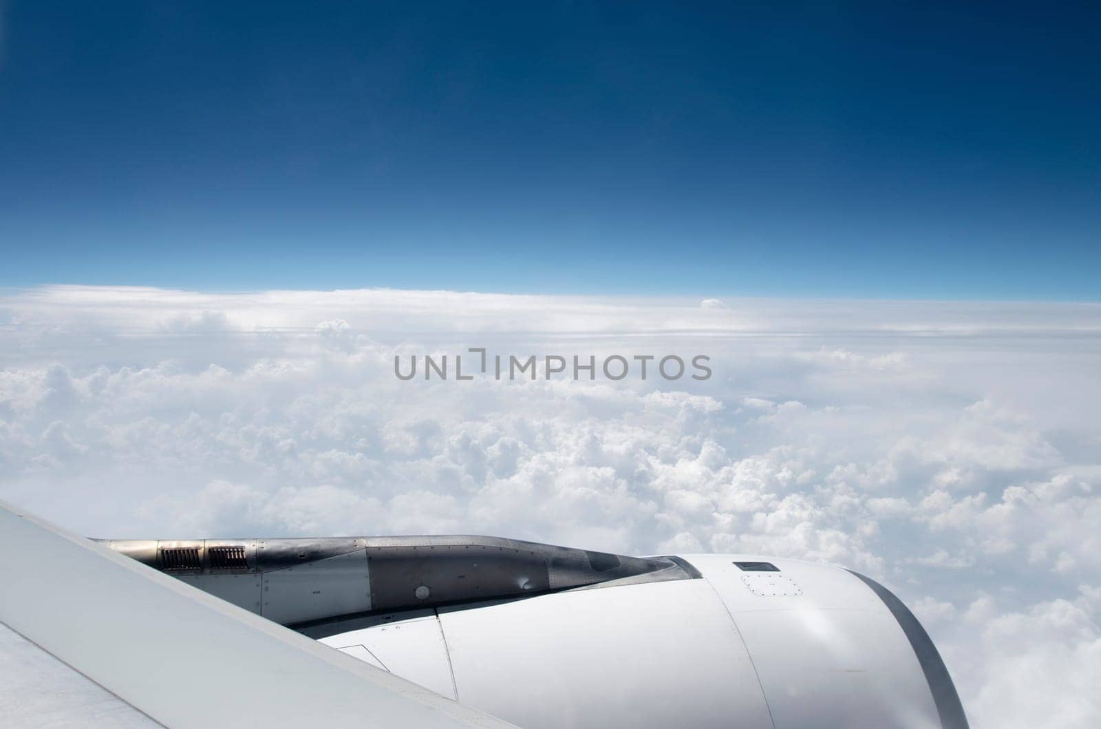 view from out of an airplane with a detail of one of the engines