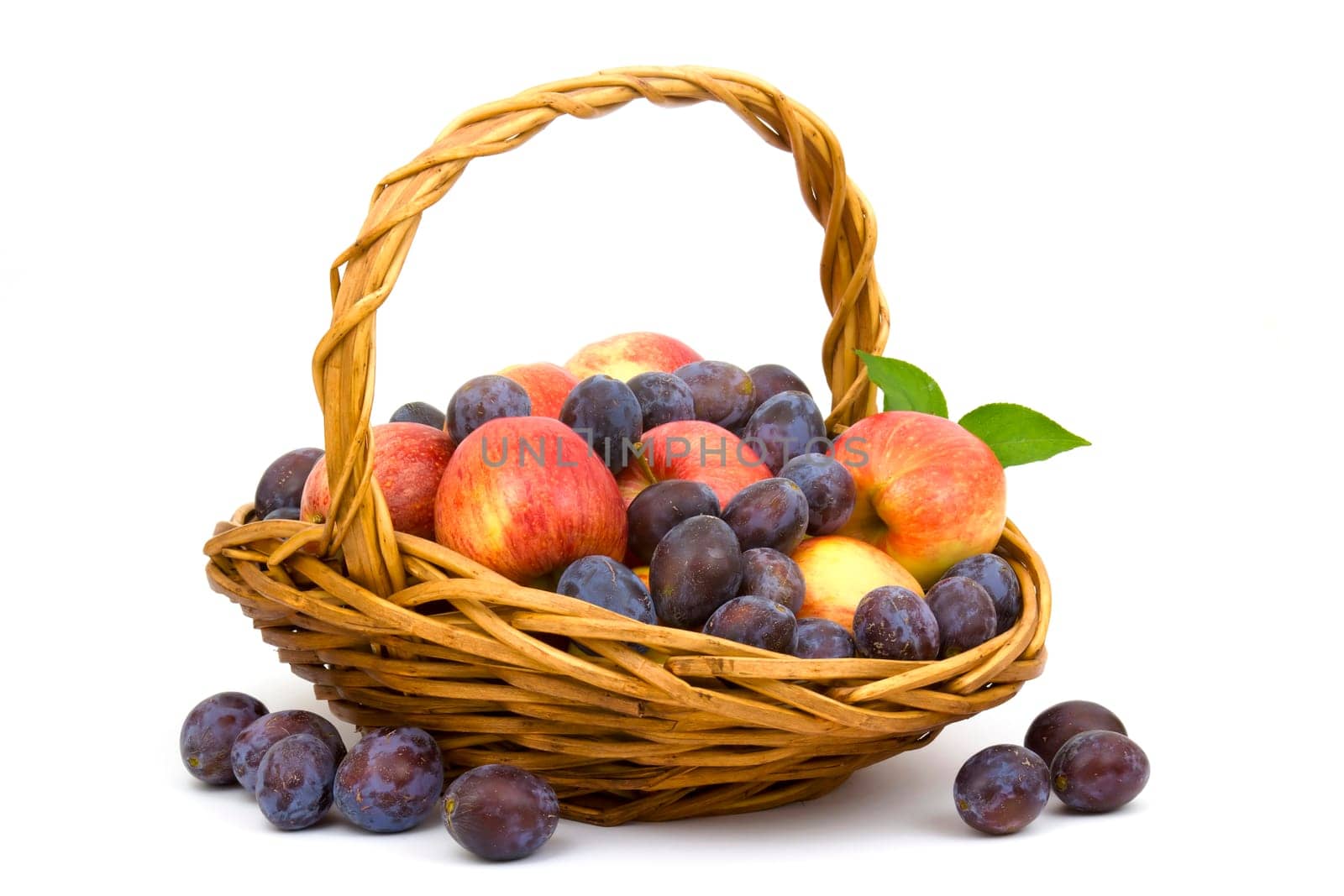 fresh fruits in a basket on white background