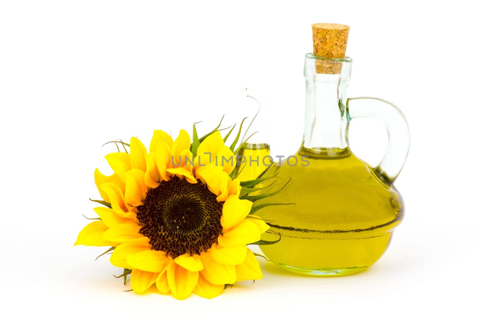 sunflower oil and sunflowers isolated on white background