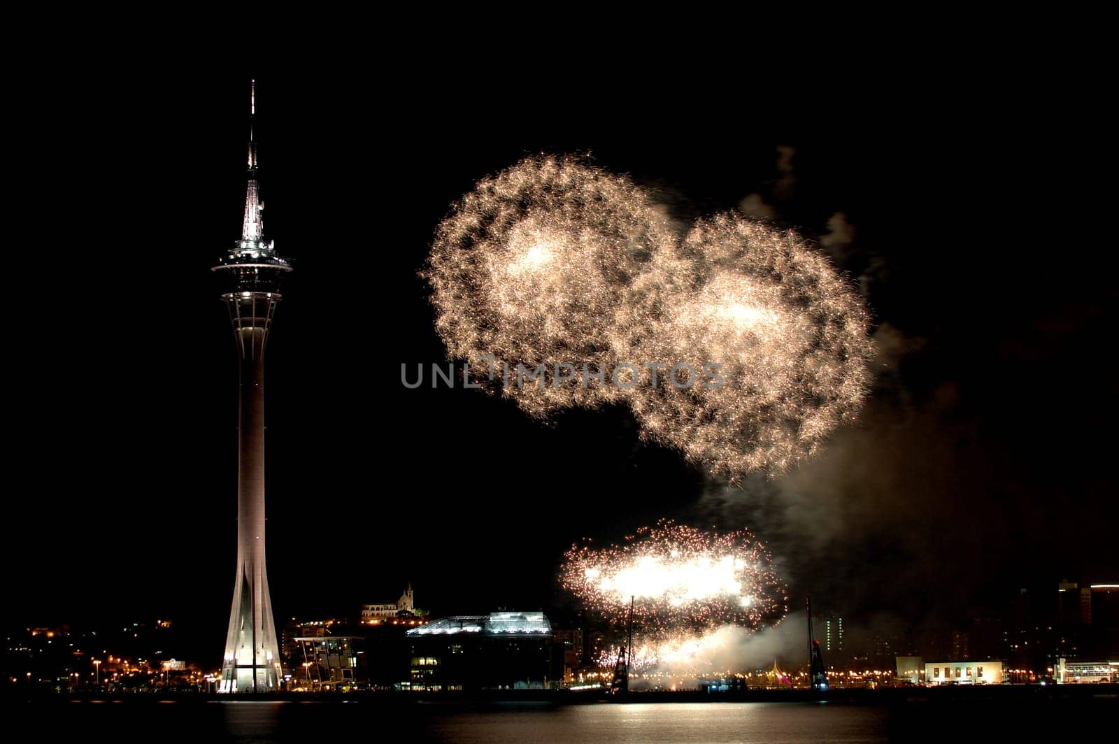 Celebration of New Year in Macau with fireworks beside the Tower Convention and Entertainment Center