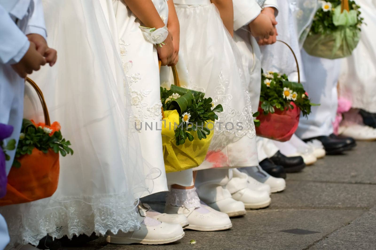 Line of flower girls on wedding day
