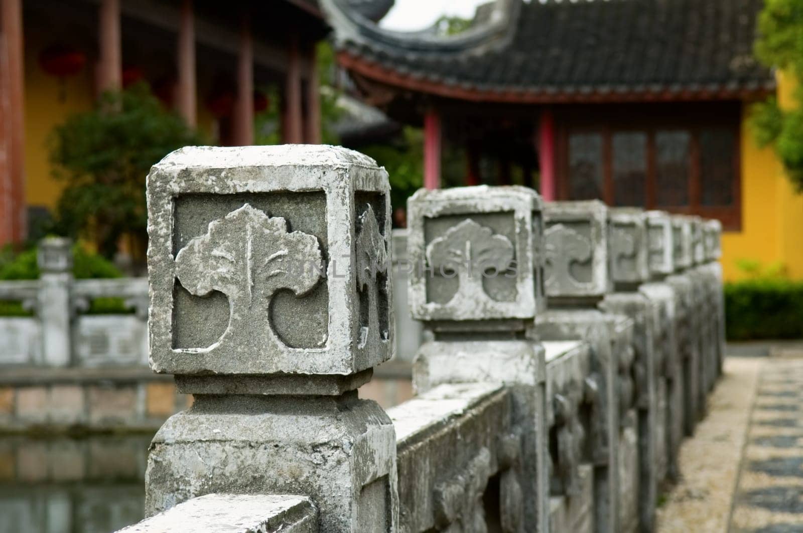 The close up view of stone carved handrail at Chinese temple