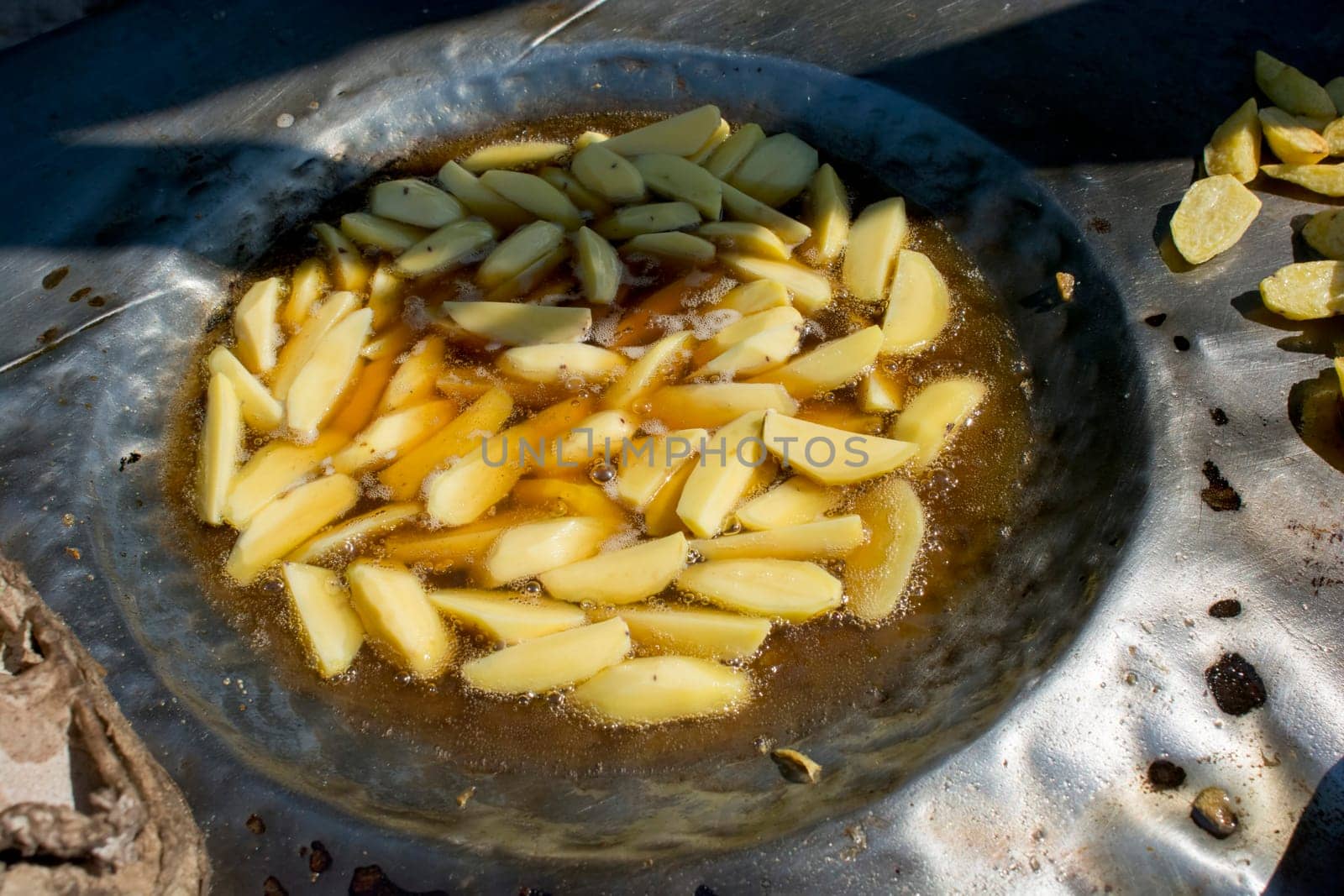 French fries in the pan at african market