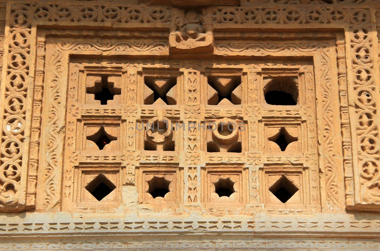 Holes of different geometrical pattern in stone window at Vijay Sthambh (Victory Tower), Chittorgarh Fort, Rajasthan, India, Asia