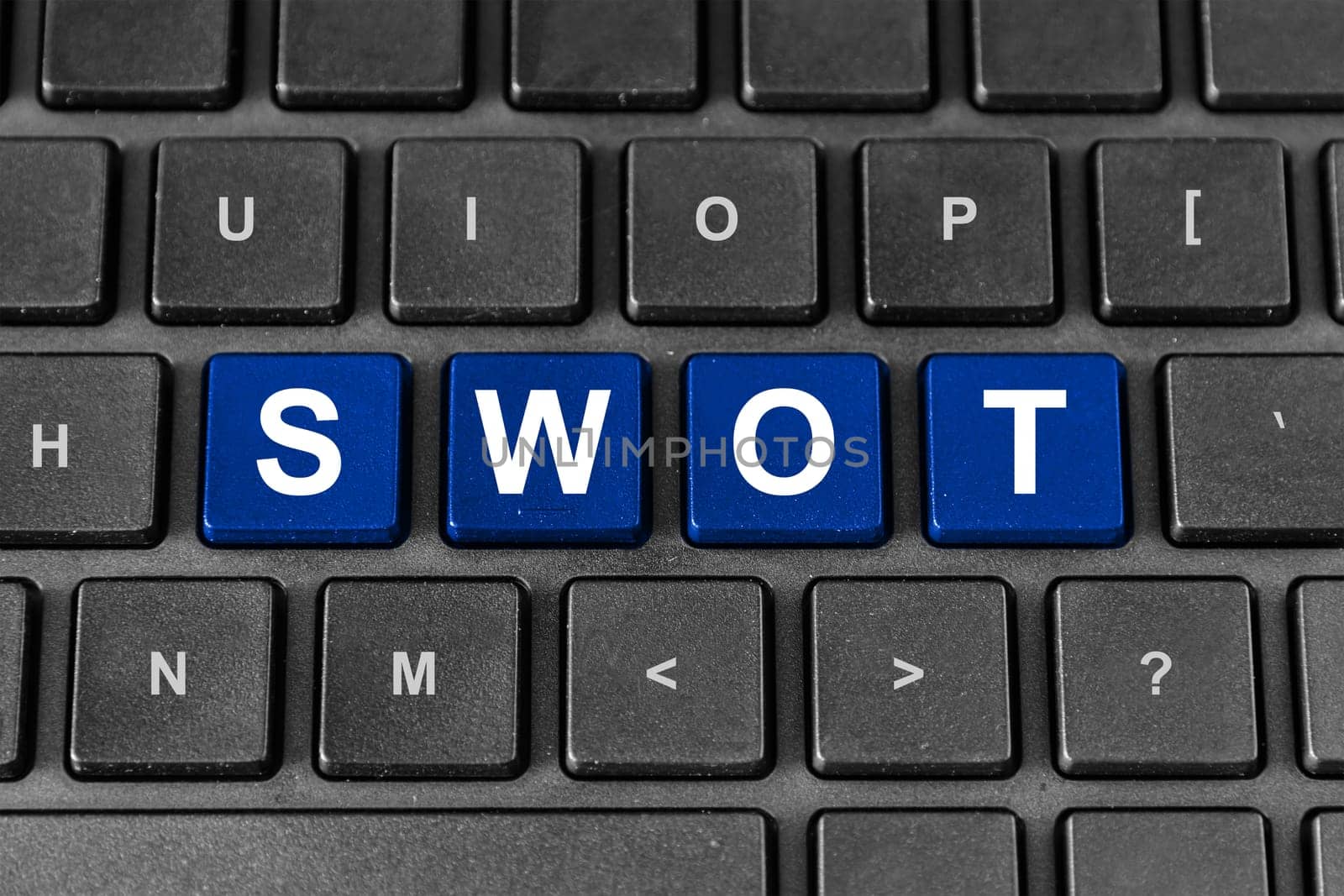 SWOT or strengths, weaknesses, opportunities, and threats blue word on keyboard