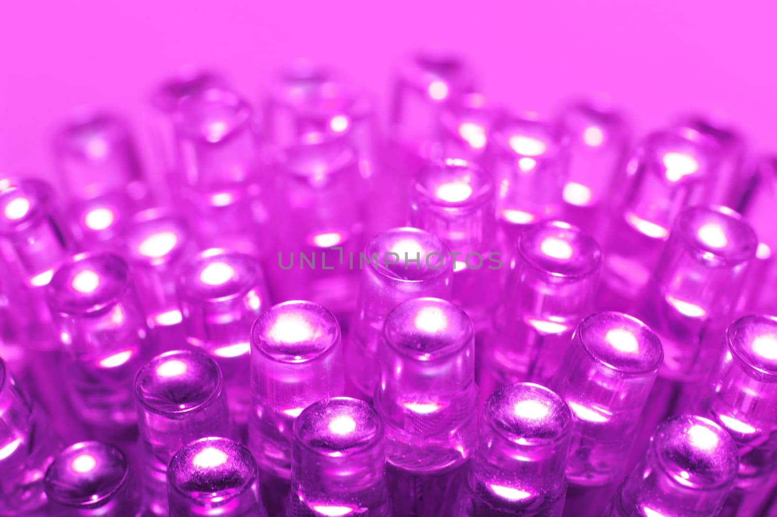 Macrodetail of some pink LEDs in pink light
