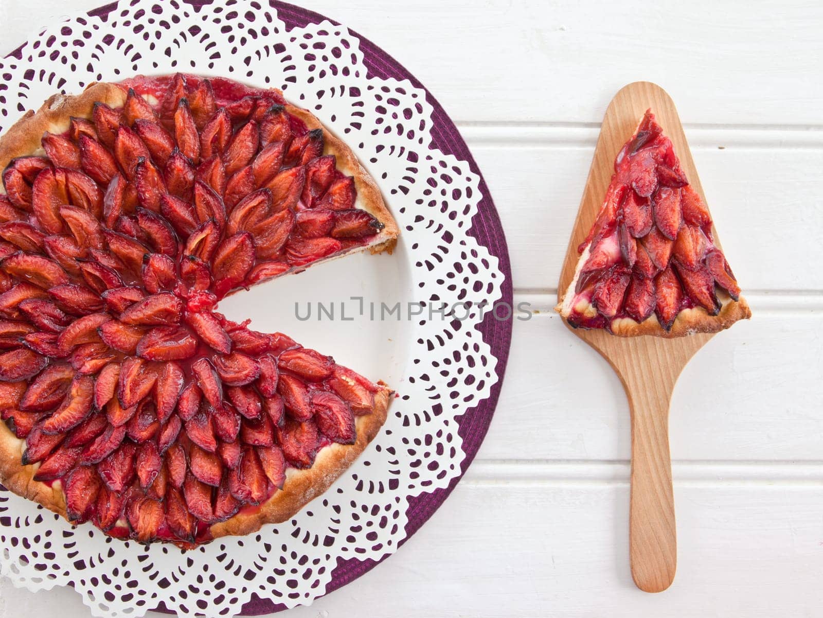 Cake with fresh plums with text clearance