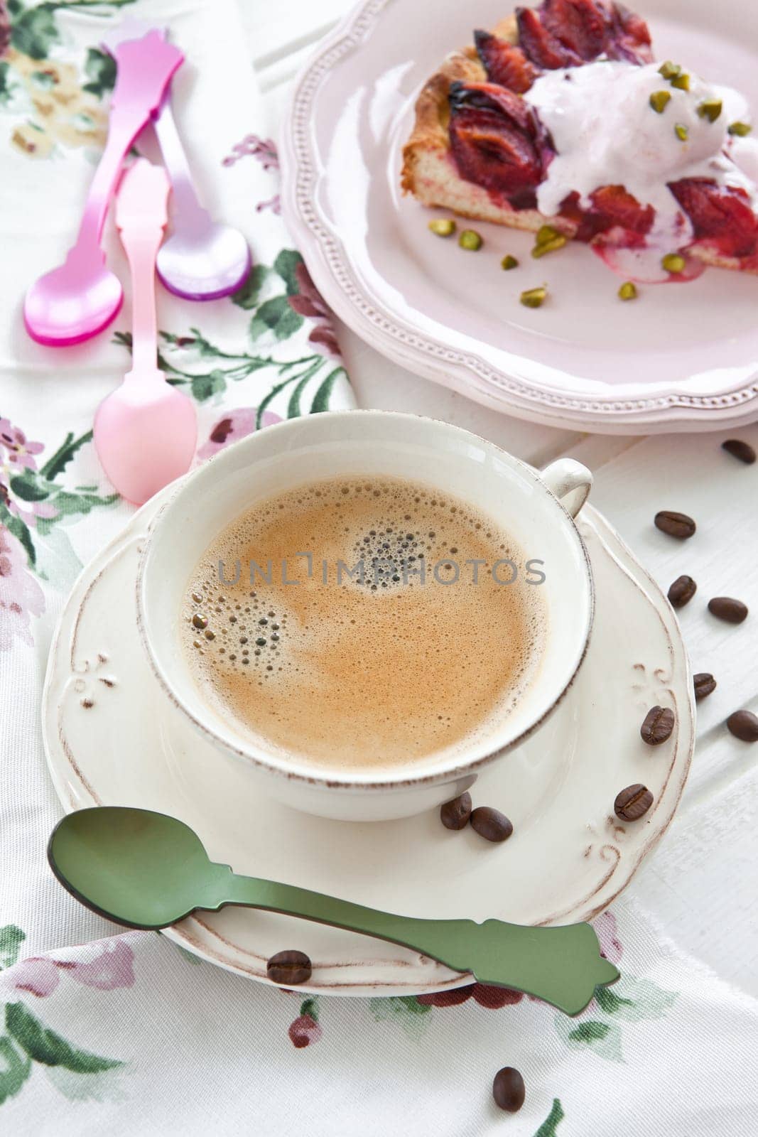 Vintage cup with coffee and a piece of plum cake