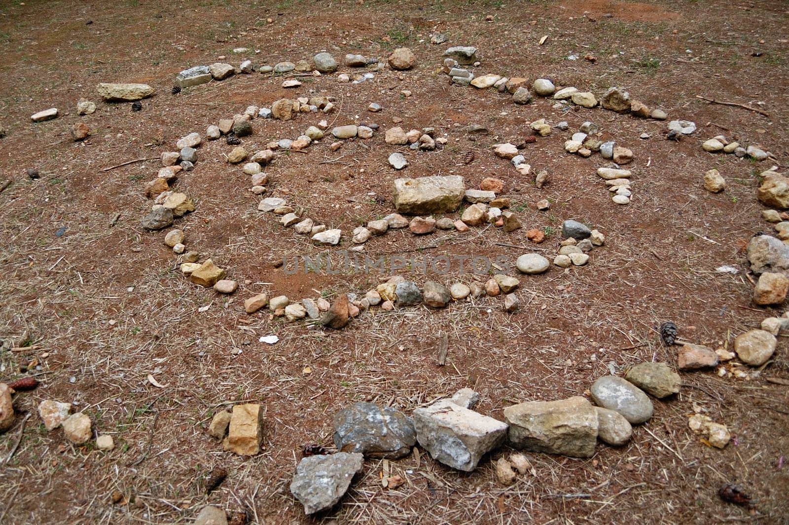 Spiral made of stones abstract geometric shape. Nature background.