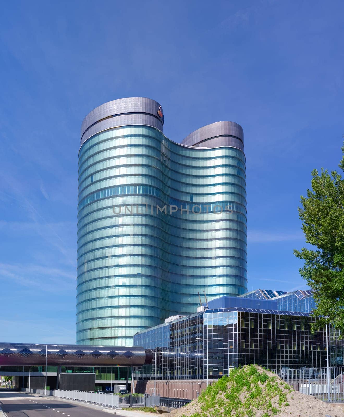 modern rabobank headquarters building in utrecht, netherlands. Rabobank is a Dutch bank, consisting of 136 (2013) independent cooperatives with all its own banking license from the Dutch Central Bank