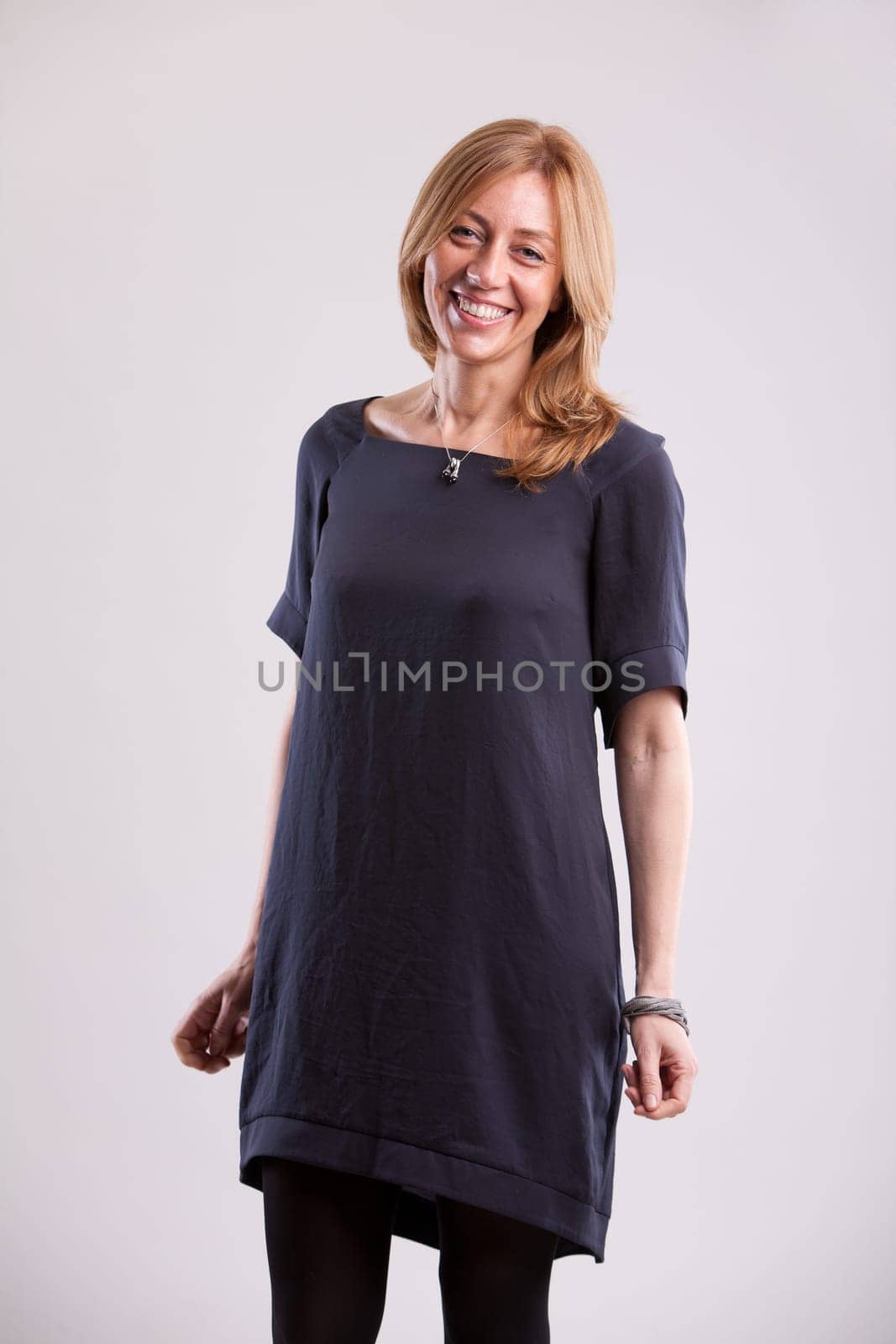 a real ordinary woman smiling at camera  she's beautiful even if she isn't a model