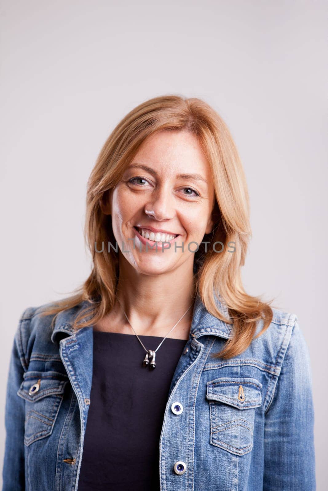 this is a real, natural, ordinary woman smiling at camera  not a model, not a young girl but a normal, real woman