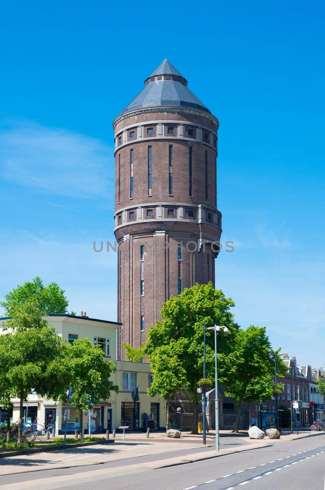 old brick water tower in utrecht, netherlands. Built around 1917, it has a 1000 cubic meters reservoir and a height of 43,5 meter