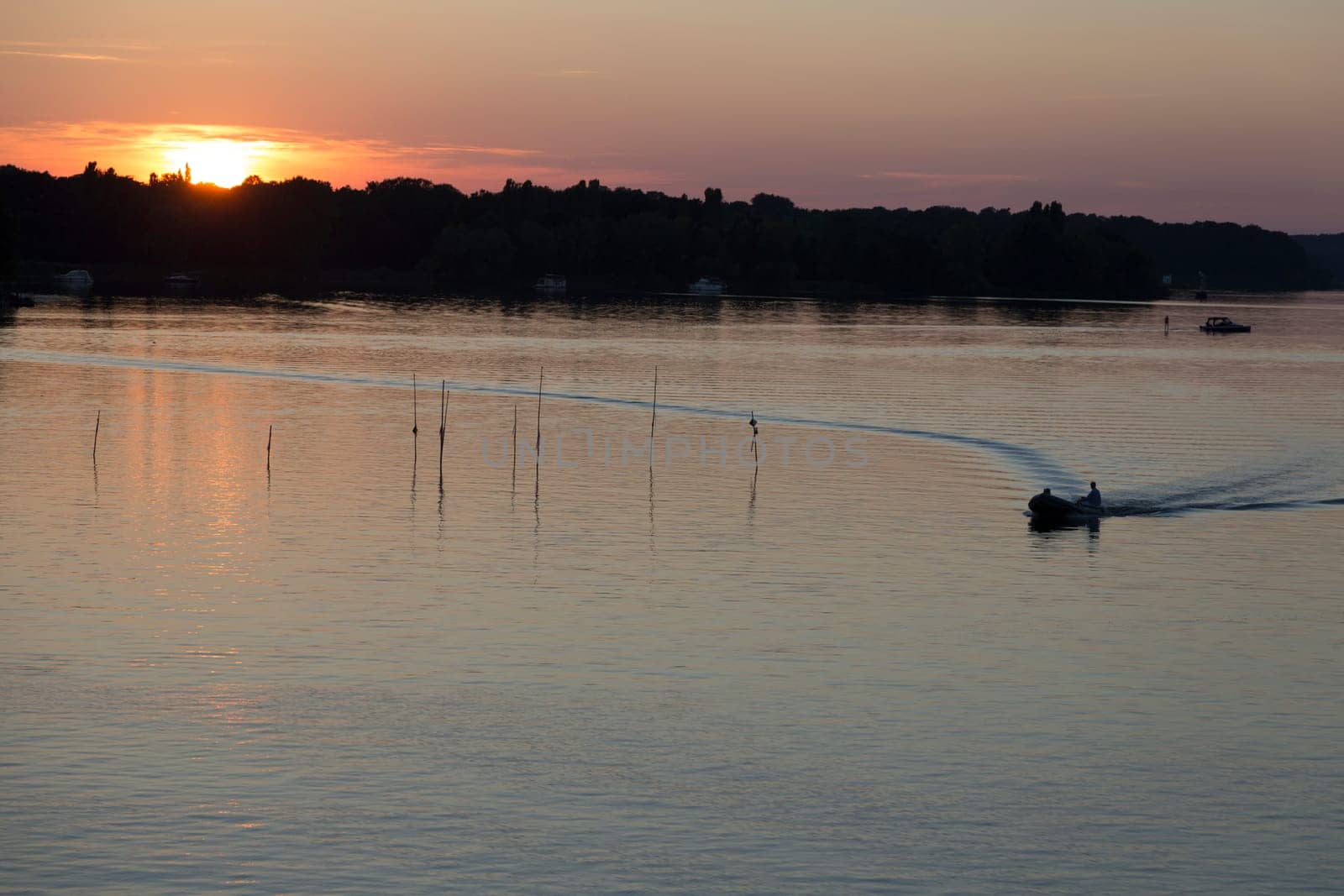 Small motorboat before sunset at the Jungfernsee