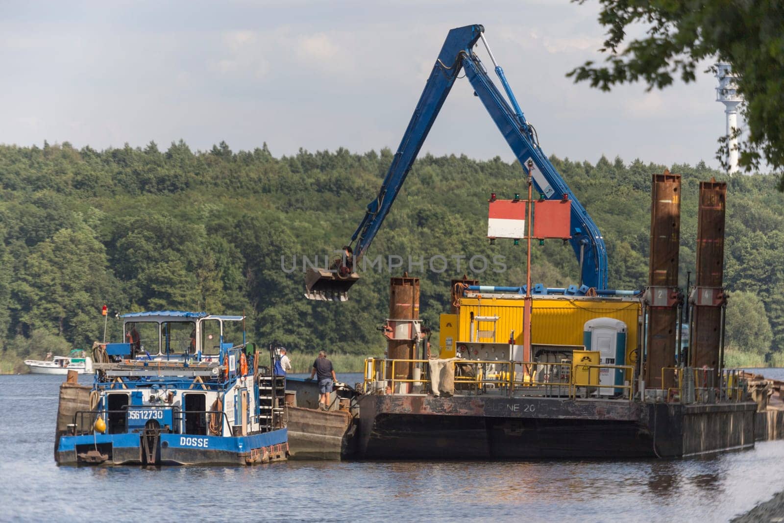 Ship and excavator in the canal