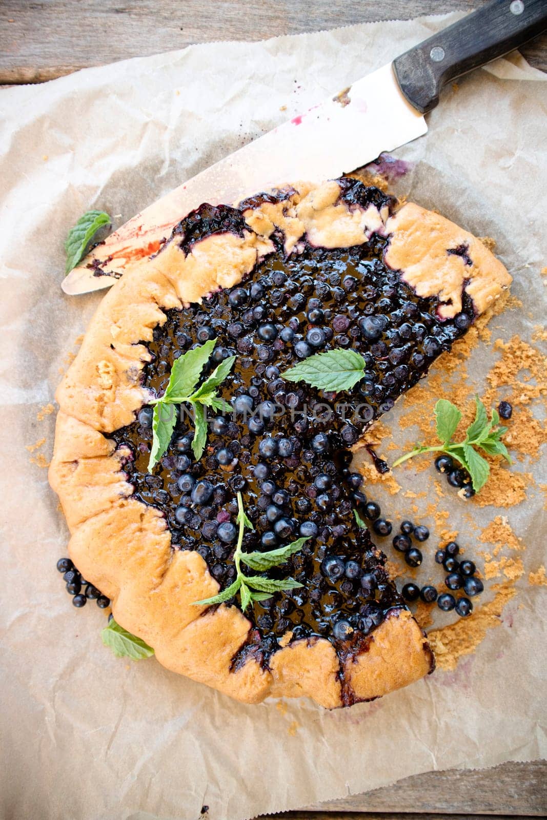 Photographic documentation of a rustic cake made with wild blueberries 