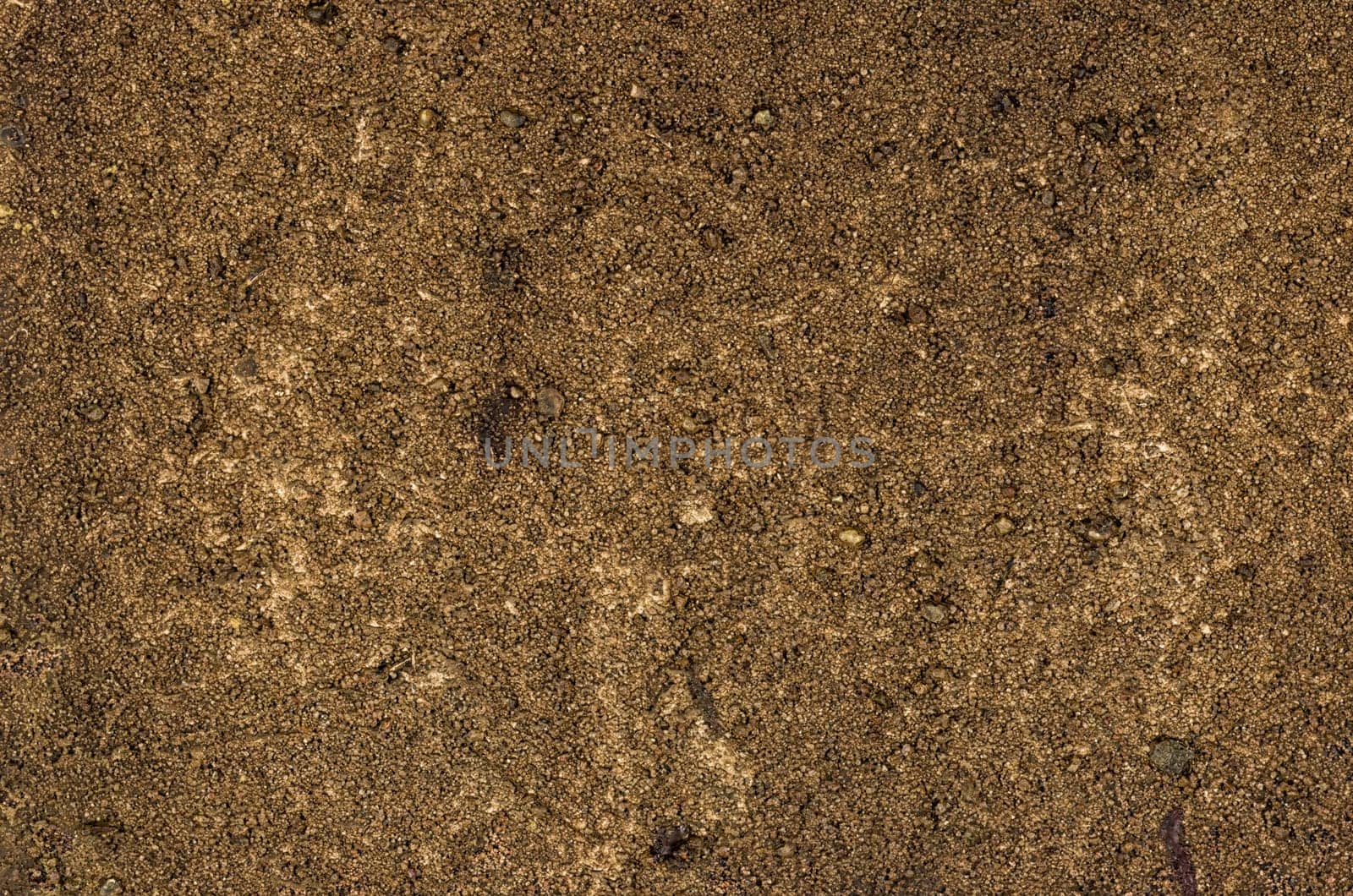 Detailed view of a canvas with acrylic paint and sand