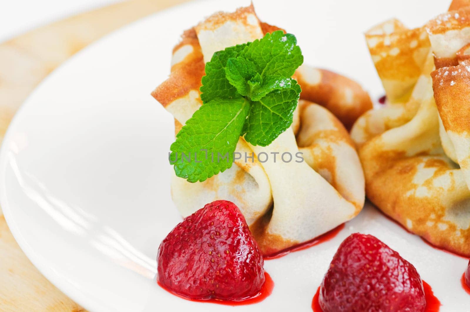 Pancake with curd cheese and fresh strawberries