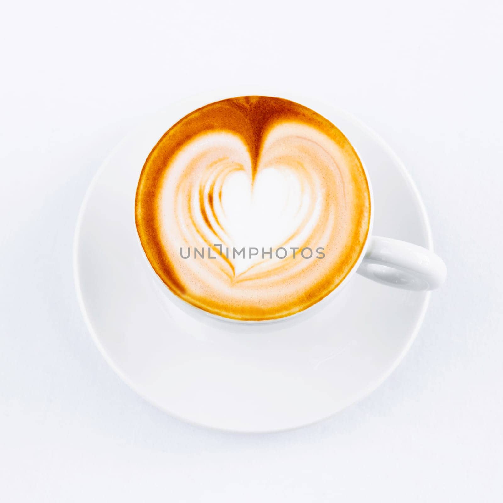 cappuccino cup with drawing on scum on white background