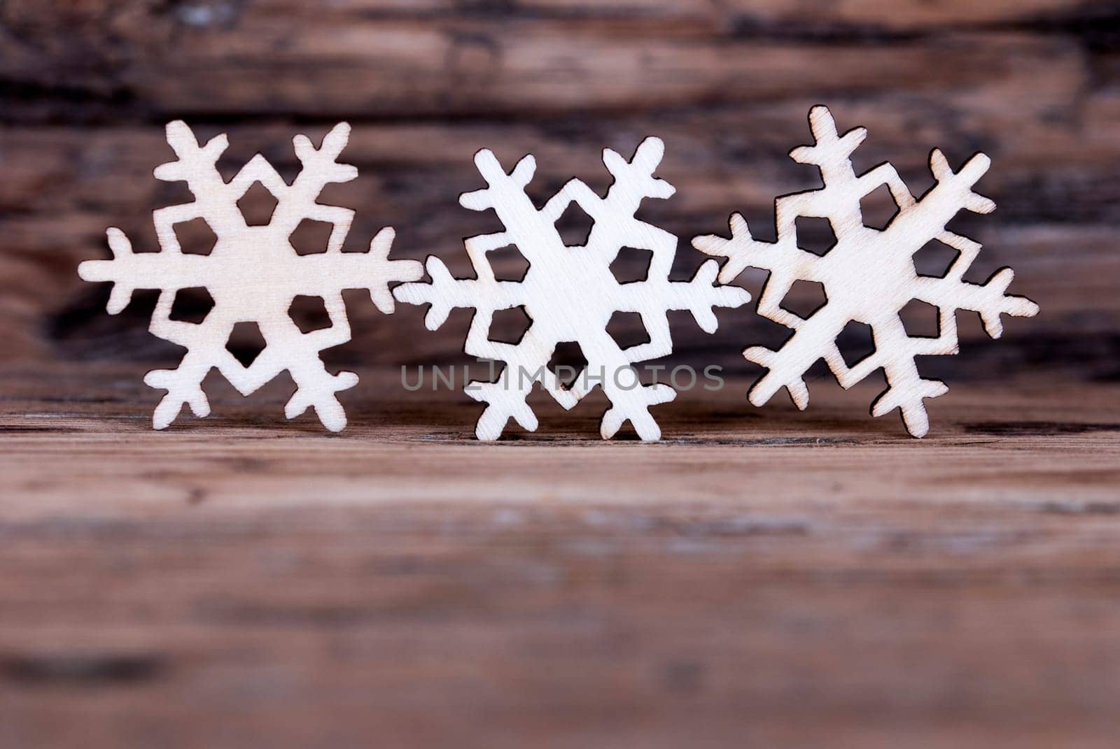 Some Snowflakes on Wood with Copy Space for your Text