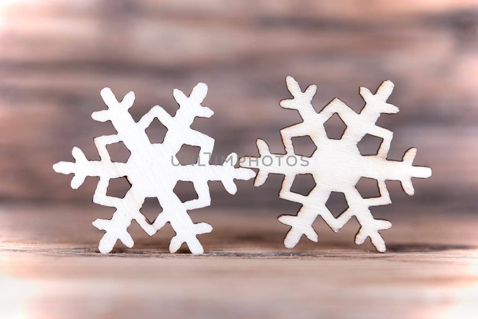 Two Snowflakes on Wood, Light Winter or Christmas Background