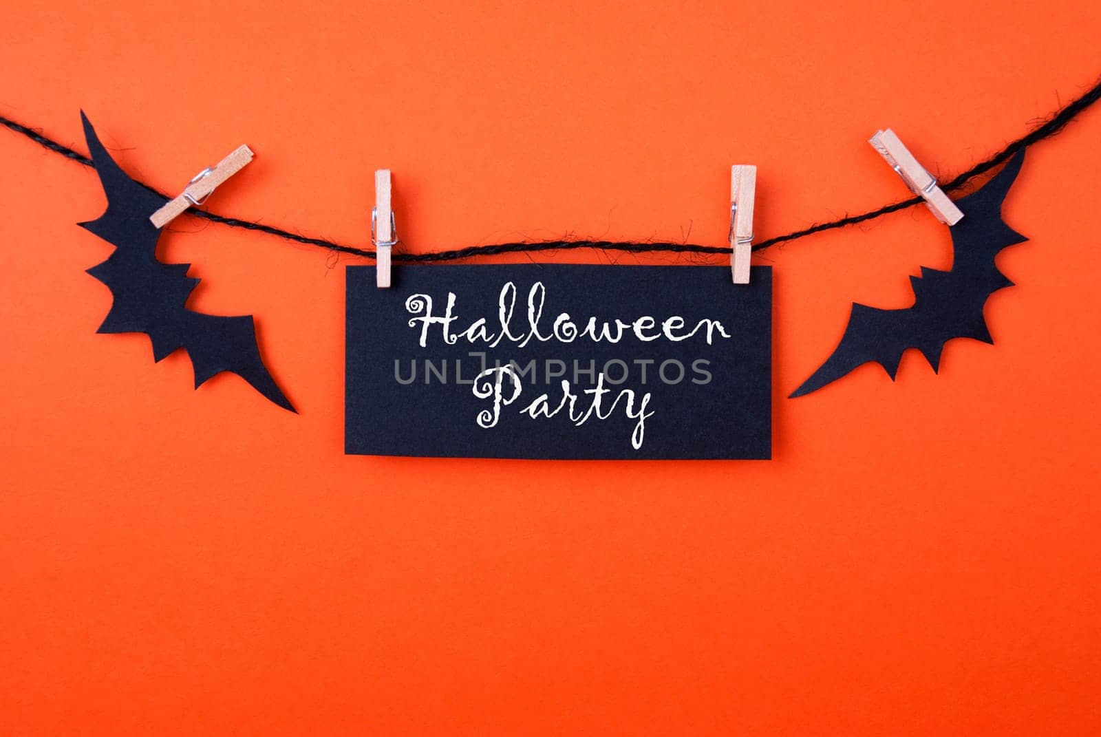 Black Label with the Words Halloween Party on Orange Background
