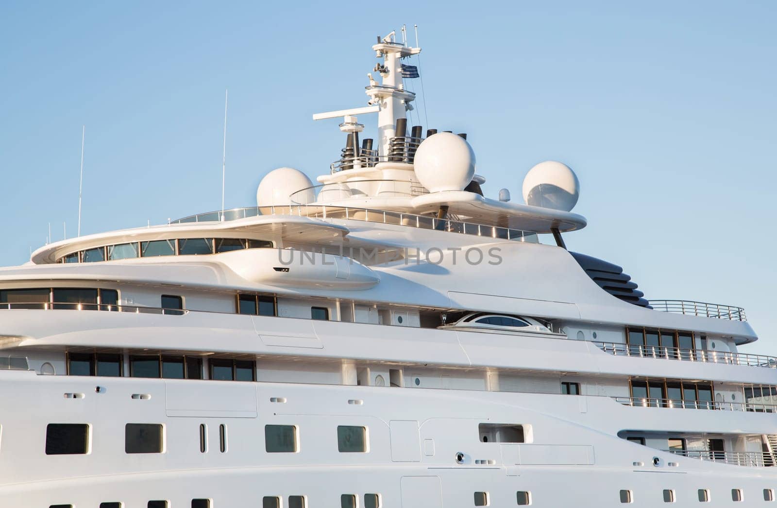 Gigantic big and large luxury mega or super motor yacht on the blue ocean.