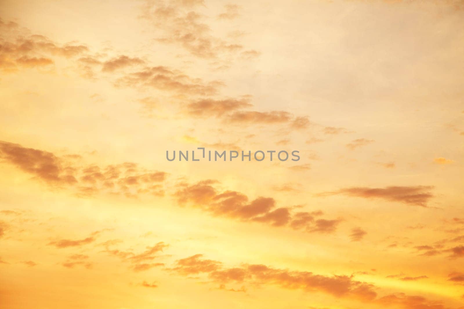 Yellow and orange sky when the sun is rising up. Background or texture for dreaming concepts.
