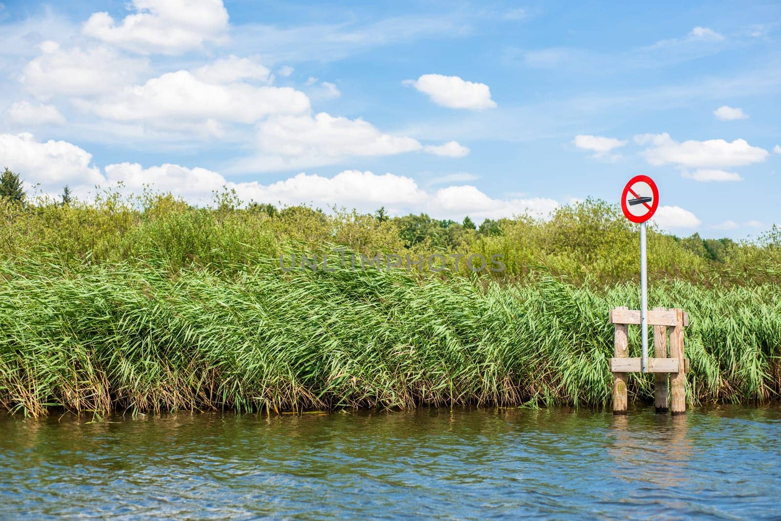 Lake scenery with a red no boating sign