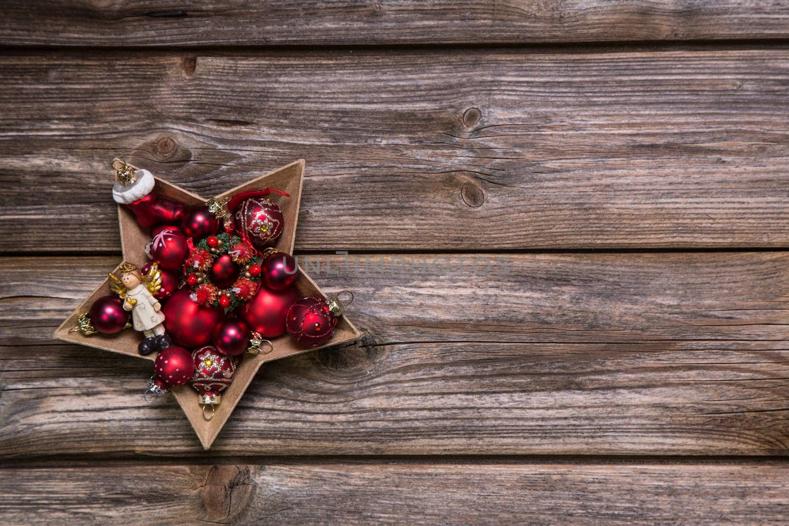 Old antique christmas background with red advent balls like a star.