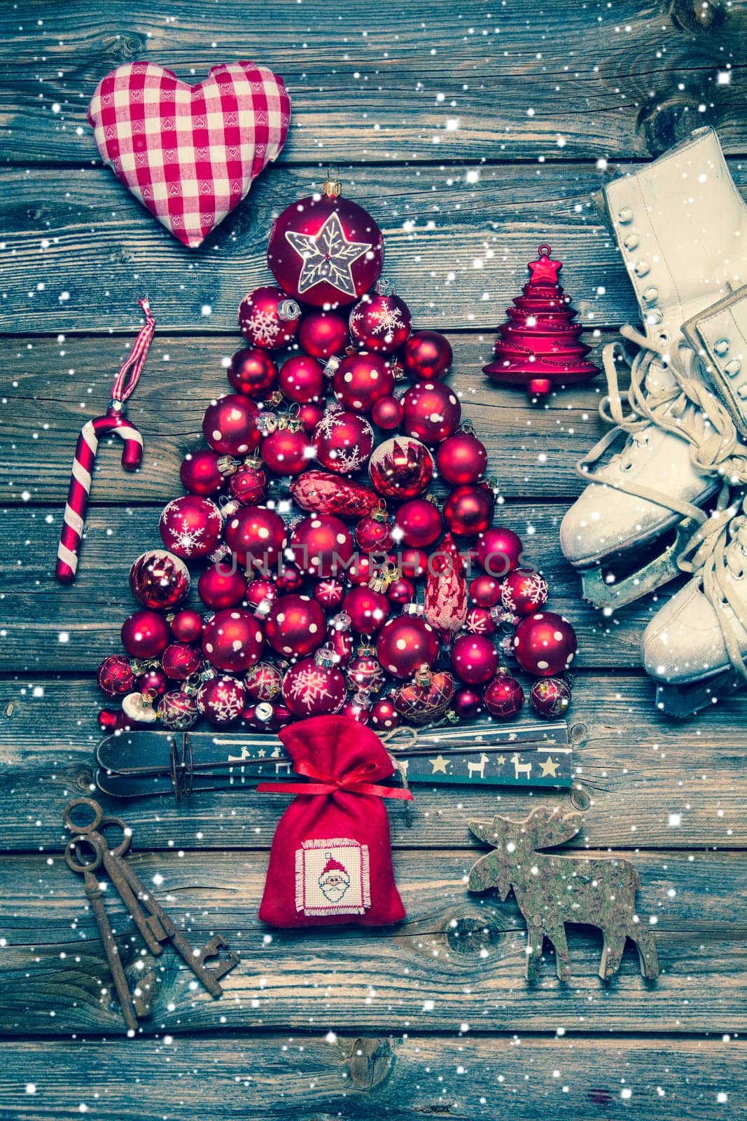Christmas decoraion in red and white on wood in rustic vintage style with snowflakes.