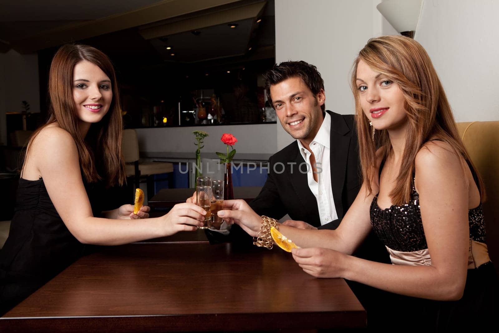 Group of friends together having fun. Focus on the man