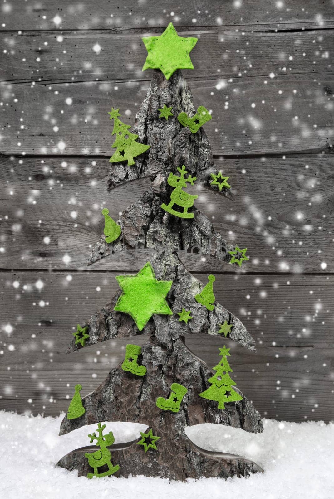 Handmade christmas tree with green decoration of felt in shabby style.