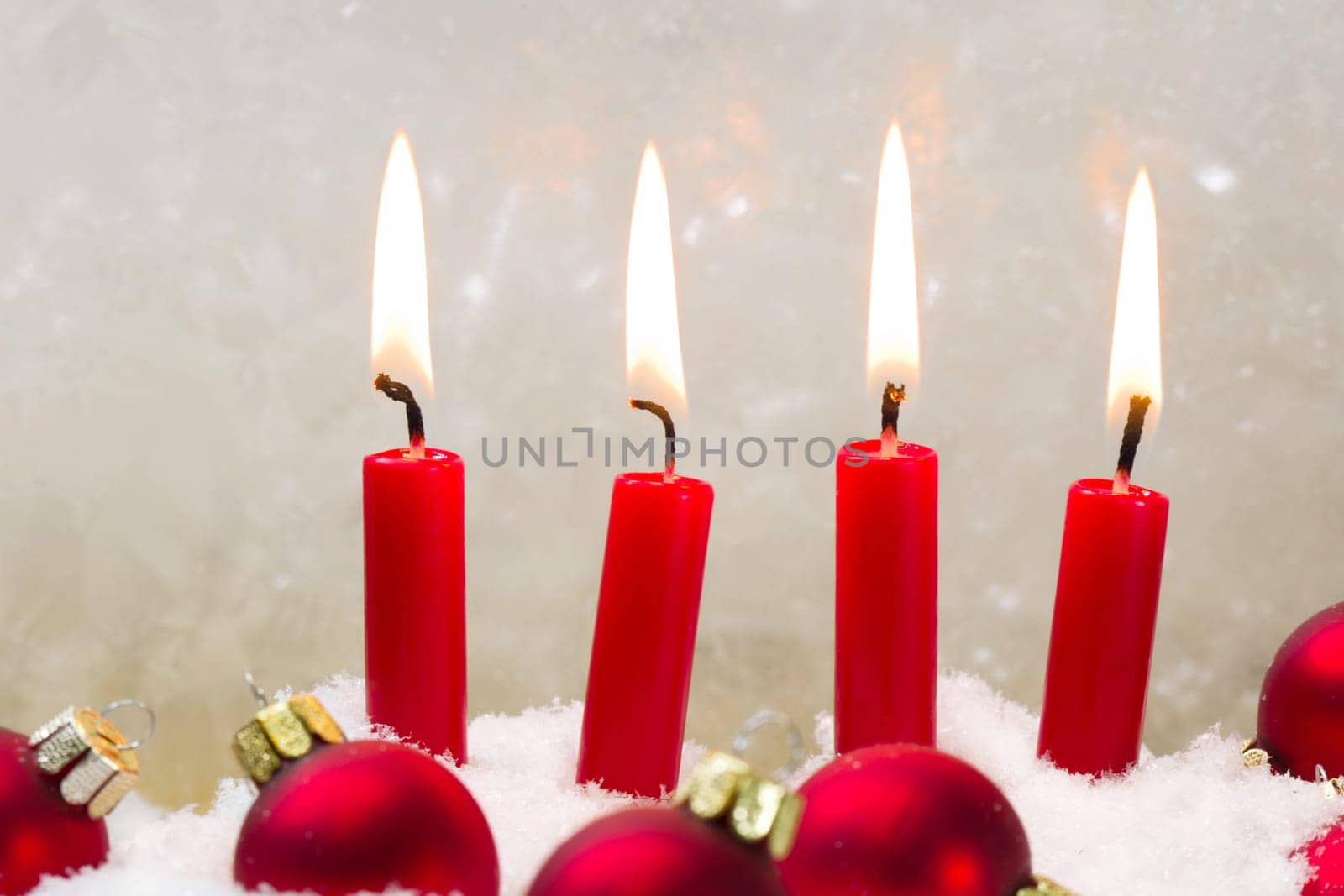 Four red candle with christmas ball advent - chrismas time