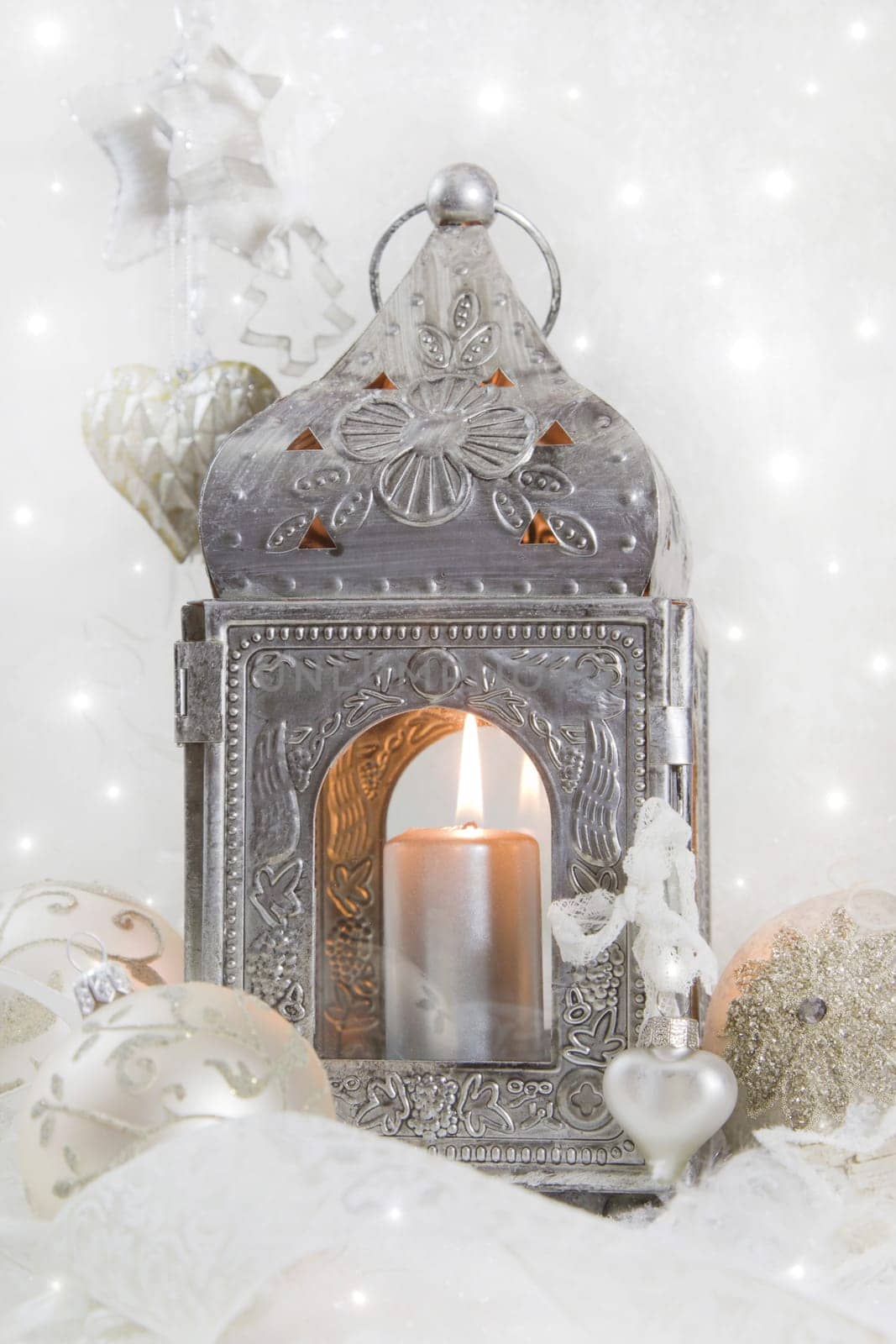 Christmas decoration with a latern in white and silver for a christmas card