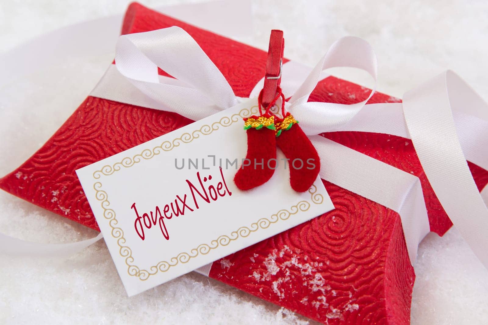Close up of red present box with french text for christmas