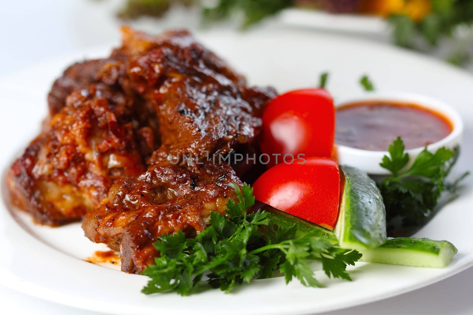 Delicious beef goulash with greens and vegetables (closeup, selective focus)