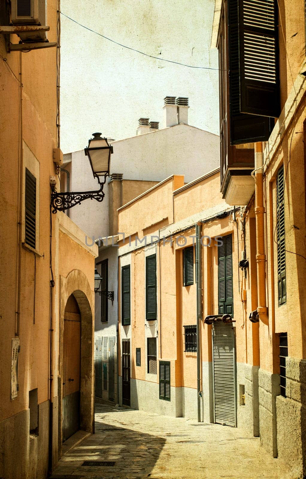 Narrow street in old city of Palma de Mallorca, Spain