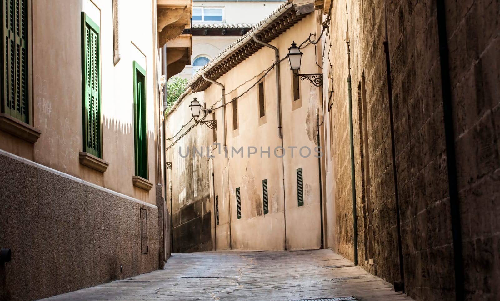 Narrow street in old city of Palma de Mallorca, Spain