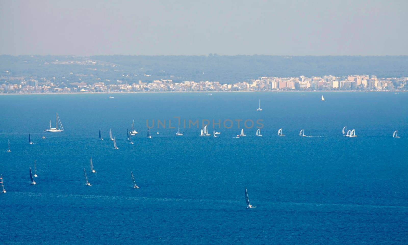 Sailing boat yacht or sailboat group regatta race on sea or ocean water. Panoramic view.