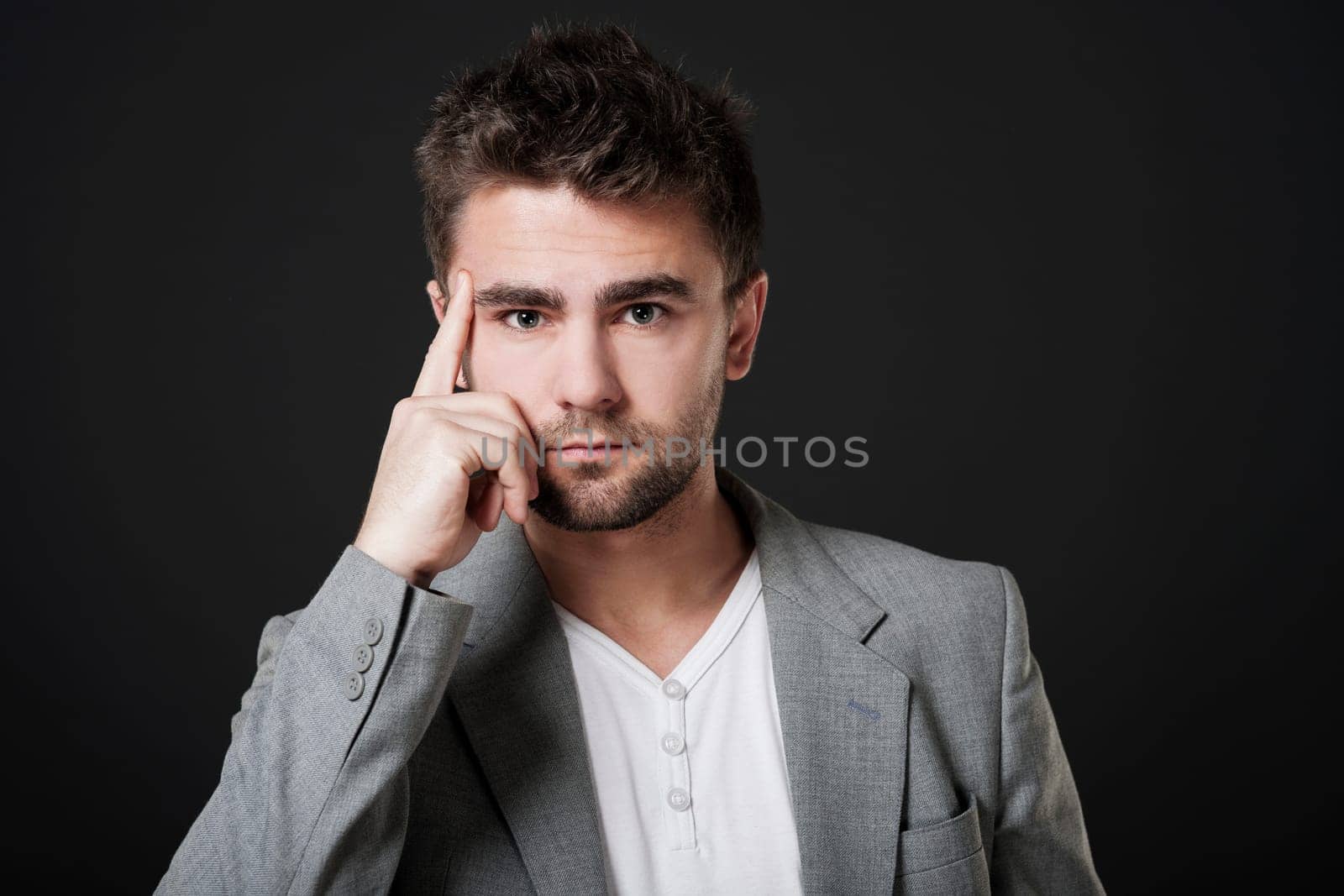 Attractive man with hand on chin