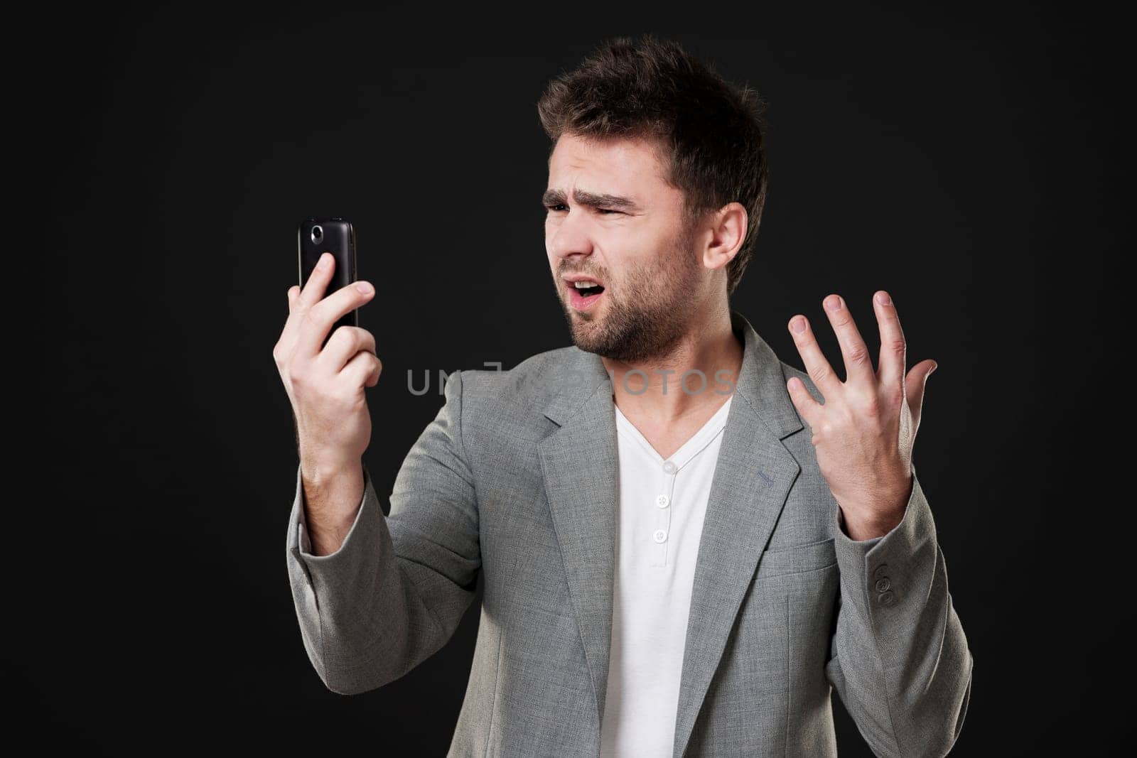 Frustrated man with mobile phone