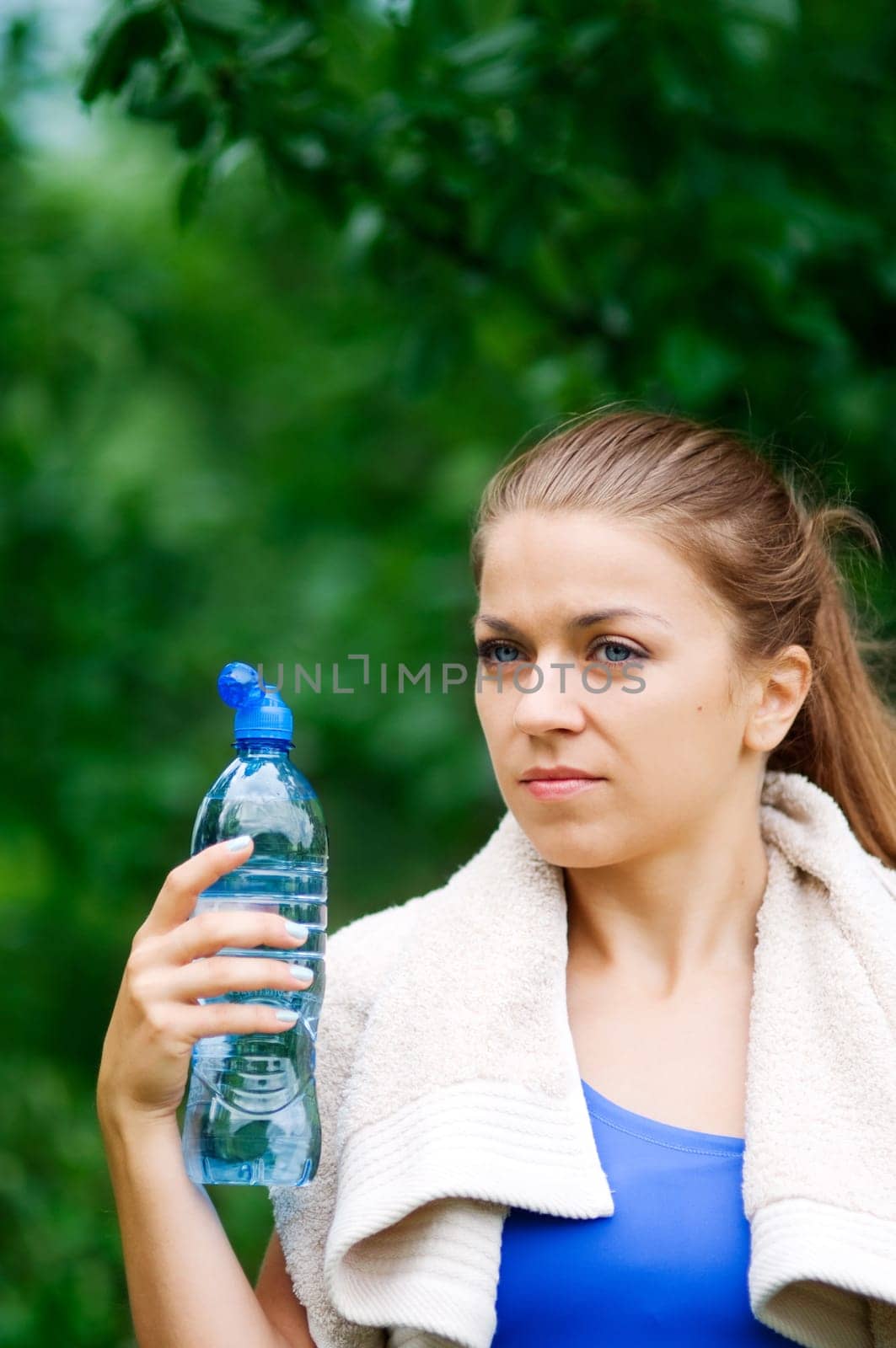 Young woman holding water bottle